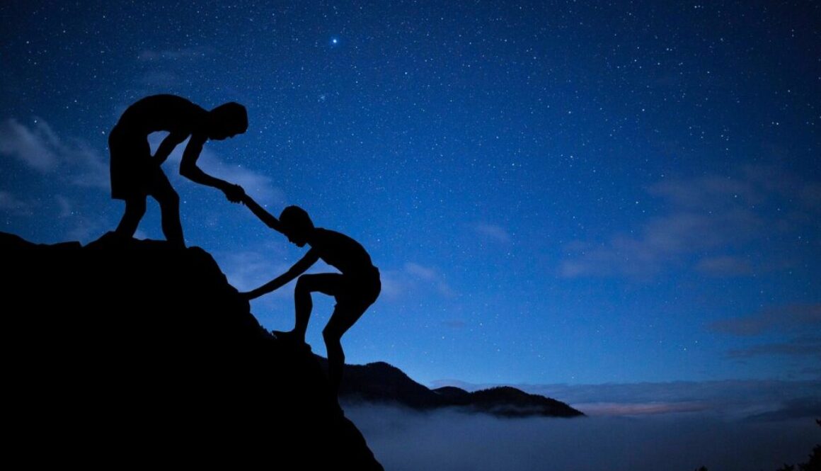 men mentor help climbing mountain 3610255